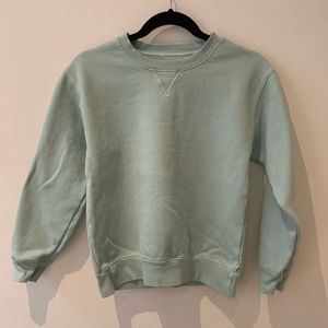 Mint green sweater.